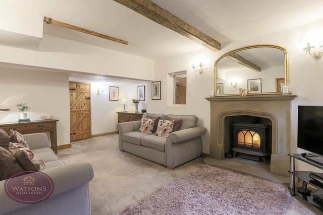 Let's start our tour of the Three Horseshoes in the lovely lounge, which is distinguished by its exposed ceiling beams and sandstone fireplace with inset multi-fuel burner.