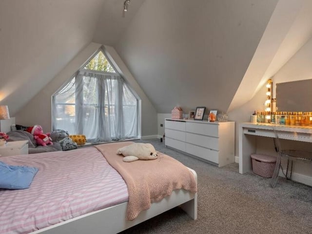 The delightful third bedroom also has ample space for storage and a dressing table.
