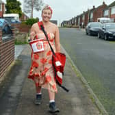 Post lady Katy Haydon doing her round in a poppy dress. Picture: Brian Eyre