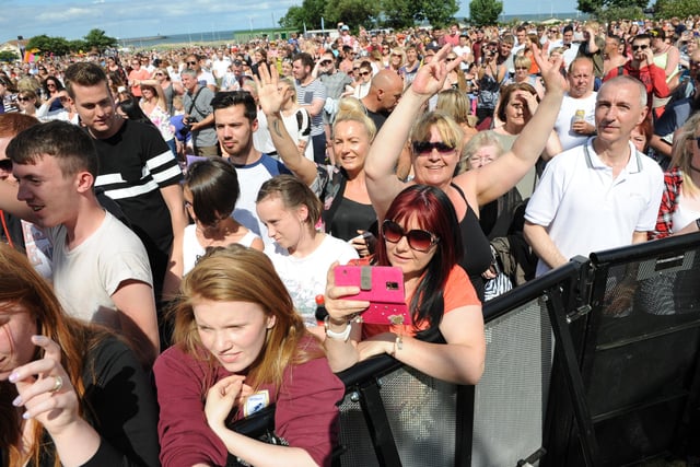 A close-up on the crowd watching Hometown, Lily Brooke, The Waiters, 5ive and Atomic Kitten in July 2015.