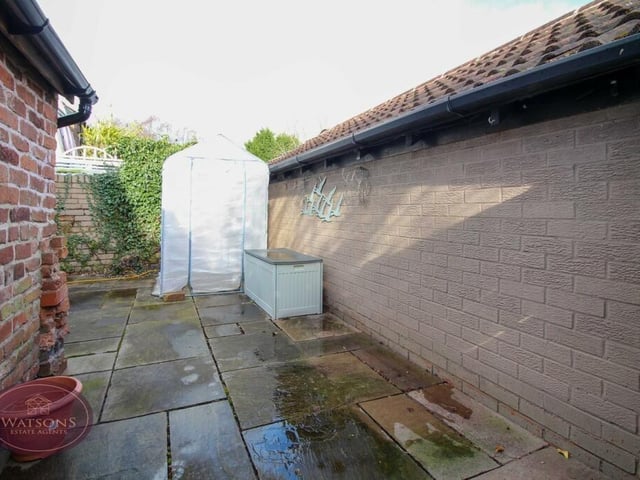The garden at the back of the £325,000-plus cottage contains a paved patio area that is a pleasant space in the summer.