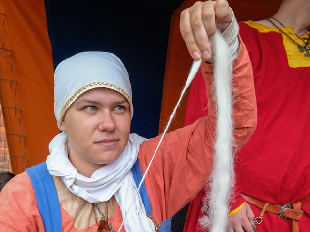 A Viking re-enactment of wool spinning.
