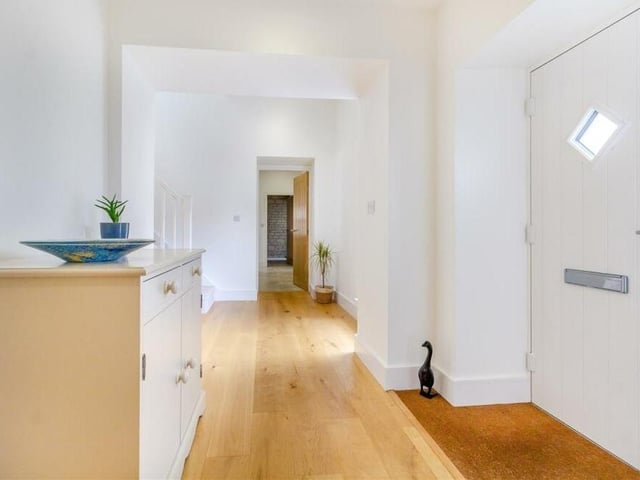 Once inside the £625,000 Mansfield property, you are greeted by this inviting entrance hall, with an engineered oak floor, underfloor heating and five ceiling spotlights.