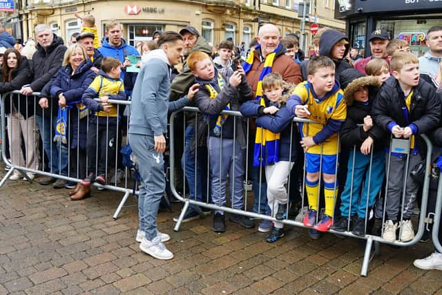 Crowds packed into Mansfield town centre to salute their football heroes. Mansfield Town FC players visited fans.