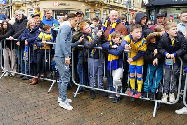 Crowds packed into Mansfield town centre to salute their football heroes. Mansfield Town FC players visited fans.