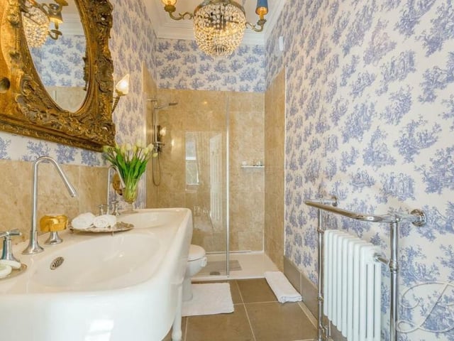 And here is that en suite shower room, complete with a walk-in shower cubicle, double hand wash basin and low-flush WC.