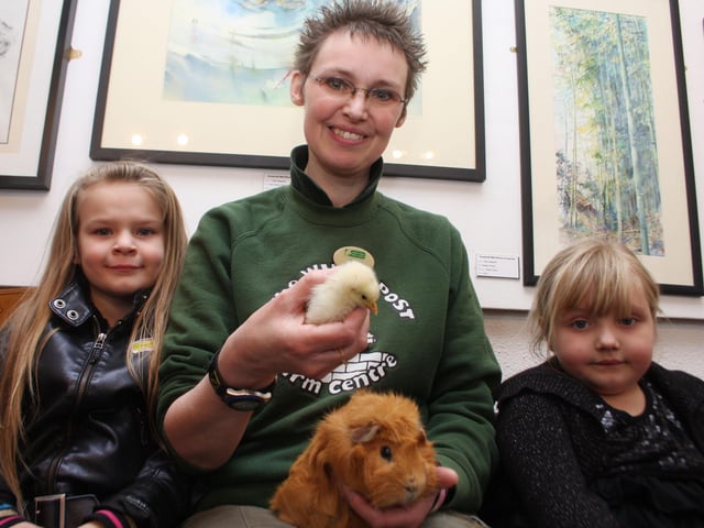 Amy Tatler, six, Farm guide Sarah Roberts and Stevie-Faye Lawson, six with some of the animals from white post farm