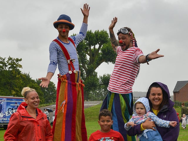 a light shower at the Summer Festival at Carr Lane Park, Warsop, enjoying the day are Kerry Wragg and Donna Fox with Isaac Wallace, seven, and Tia-Mae Wragg