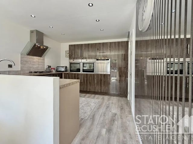Undoubtedly the heart of the home is the spectacular open-plan kitchen and dining area, perfectly positioned to the rear to make the most of the delightful views across the beautifully established rear garden.