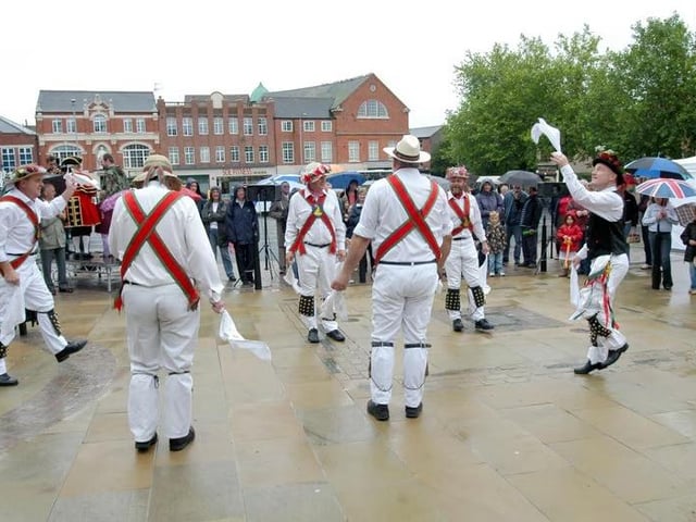 Morris Dancers entertained the people who braved the rain at Hucknall's Market reopening.