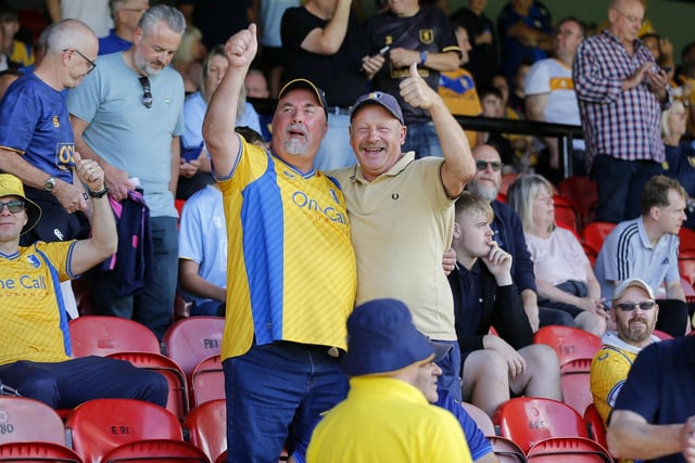 Mansfield Town fans watch the 1-1 draw at Grimsby in League Two.