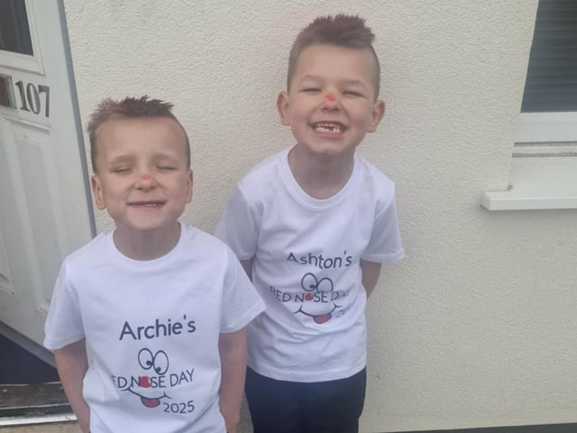 Archie, 5, and Ashton, 6, in personalised shirts for the day.