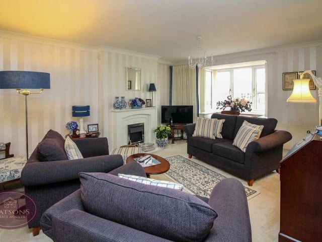 We start our tour of the Laverock Close property in the main reception room, which is an open-plan, L-shaped lounge with dining area. A double-glazed bay window faces the front of the house.