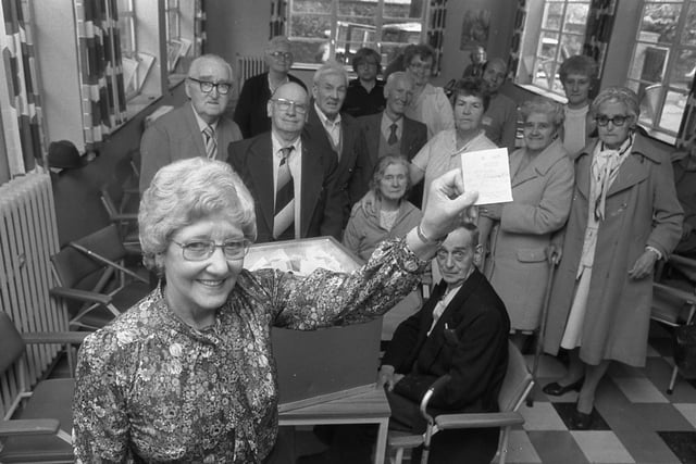 Coun. Mrs Annie Pratt from Age Concern picks the winning ticket in a raffle, watched by  members of the Wednesday Day Club at Grange House, Sunderland in July 1982. Who can tell us more?
