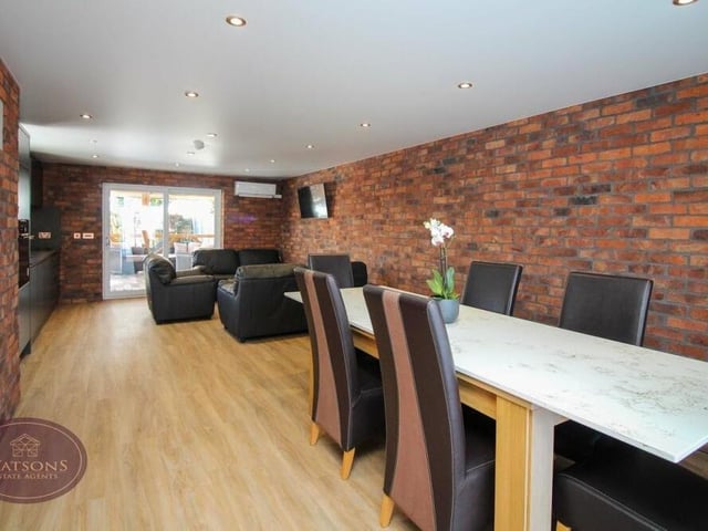 There is plenty of room for a dining area in the annexe's open-plan living space, while sliding doors lead out to a veranda.