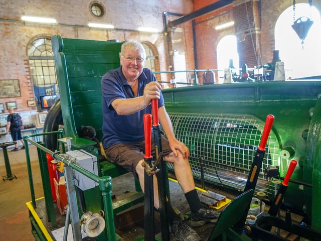 Tony White next to a 1923 Markham engine.