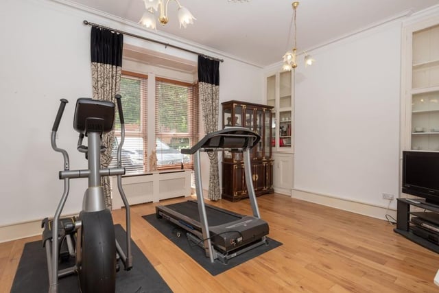 A second dining room or living room at the Park Street house is currently being used as a gym or fitness room.