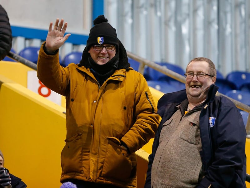 Mansfield Town's faces in the crowd against Swindon Town.