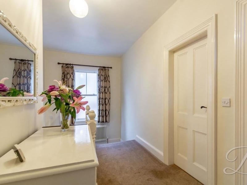 The first-floor landing leads to four of the six bedrooms at the Alexandra Avenue property, as well as the family bathroom.