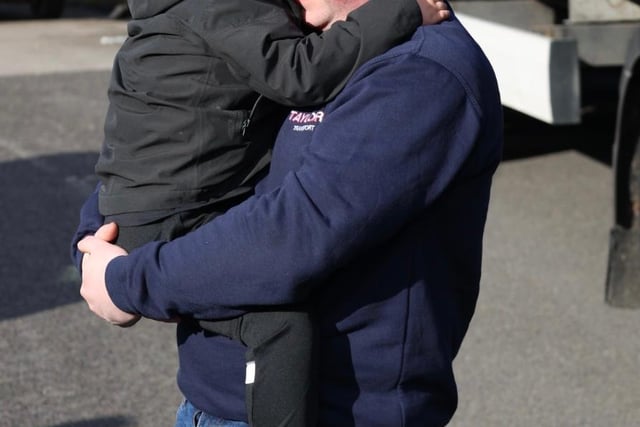 Huthwaite haulage firm Taylor's Transport driver, and champion trucker Mark Taylor gives his young son Maddox a cuddle before setting off on an epic 1300 mile journey to deliver humanitarian aid to Zamosc in Poland. Much of the aid which came from across the East Midlands was collected after an appeal by Polish-born Mansfield resident Bogusia Kavanagh.