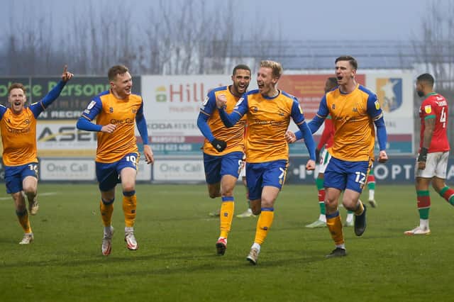 The team celebrate Harry Charsley's goal against Walsall. Photo by Chris Holloway / The Bigger Picture.media