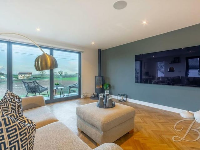 Two of the garage extension's assets are a monster-screen TV and bi-folding doors that lead to a balcony. Sit back, relax and enjoy.
