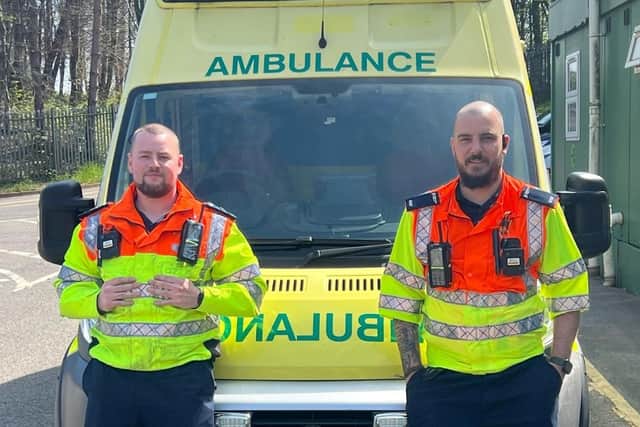 Tyler, left and Alex, with the ambulance which was taken to Ukraine