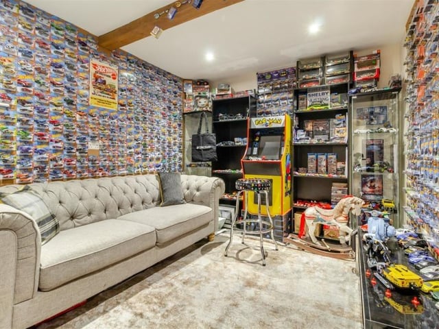 The former sorting office at The Old Village Post Office is now this snug, which is currently being used as a hobby room. With four LED ceiling spotlights, a vinyl floor and a central single beam across the ceiling, it could also be tuned into a home office or study.