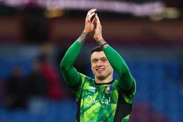 Liam Roberts celebrates on the pitch after the FA Cup fourth round between Burnley and Mansfield Town at Turf Moor in Burnley, on February 14, 2026. (Photo by Paul Currie / AFP via Getty Images)