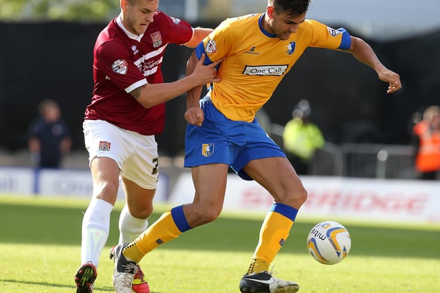 Ryan Tafazolli of Mansfield Town attempts to move away with the ball under pressure in the 2013 win.