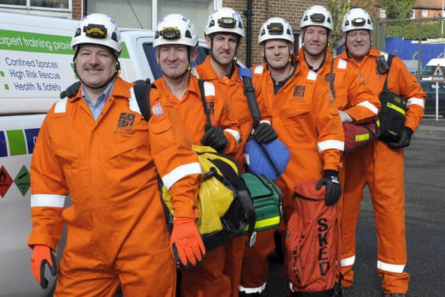 John Mowbray (left) leads a specialist emergency rescue team.