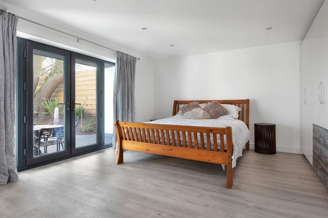 Having contemporary high gloss fitted wardrobes, underfloor heating and French doors leading out onto the front elevation affording pleasant easterly open views over adjacent countryside.