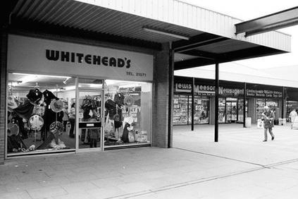 Whiteheads on Oak Tree Lane, in 1982. The shop was a former furniture and home furnishings shop. The business closed due to a compulsory purchase order related to the development of the inner ring road in Mansfield. The closure of Whiteheads is part of a broader trend of changes and redevelopment in the Oak Tree Lane area.