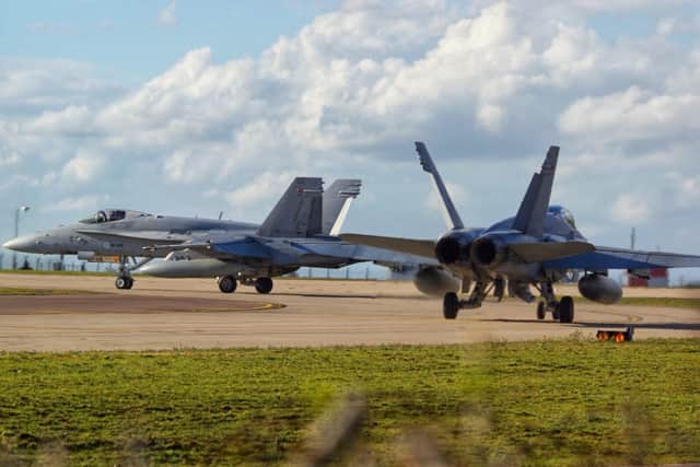 Two Finnish Air Force Aircraft, taxi towards the Runway at RAF Waddington, the aircraft in question are FA-18 Hornets, which are both loud and have been taking part in Exercise Cobra Warrior.