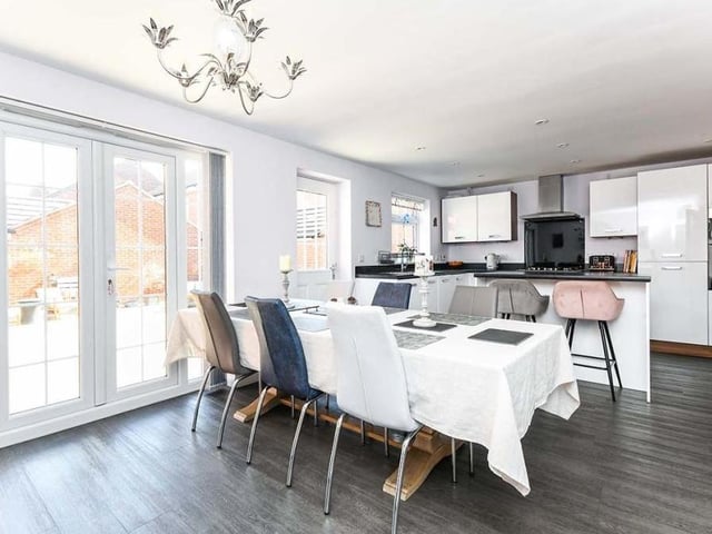 The kitchen has plenty of space for a dining table, which also offers lovely views of the back garden thanks to large French doors, which lead outside.