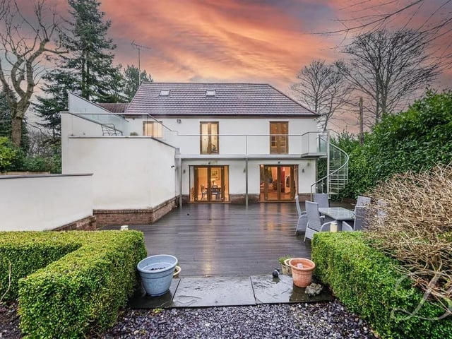 This property boasts an exclusive and secure entrance, featuring a private driveway with electric gates. The expansive grounds provide ample parking space, ensuring plenty of room for guests, residents, or additional vehicles. Not to mention a double garage adding an extra layer of functionality, offering secure storage. The rear garden is enclosed offering a serene environment, surrounded by mature woodlands. Further landscaped with a spacious lawn that has been lovingly maintained by its current owners along with a decked seating area. Finally, the elegant spiral staircase ascends to the sun terrace - perfect spot for alfresco dining and enjoy the views.