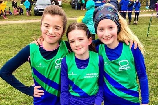A trio of Harriers prepare to race. Do you know these girls?