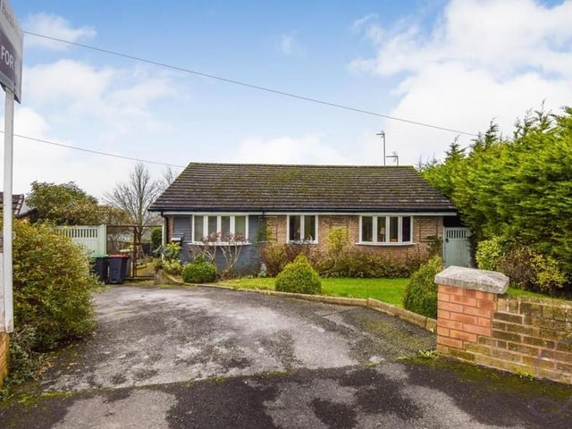 How the bungalow looks from the front, showing its kerb appeal. The driveway offers plenty of off-street parking space, while the garden, with lawn, is low maintenance.