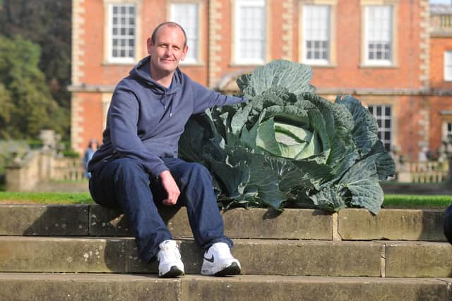 Craig Pearson, from Clipstone, Mansfield, with his 26.2kg winning cabbage in the Giant Veg Competition at the 2021 Harrogate Autumn Flower Show.