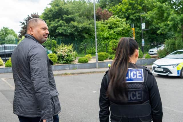 Nottinghamshire PCC Gary Godden alongside a Nottinghamshire Police officer