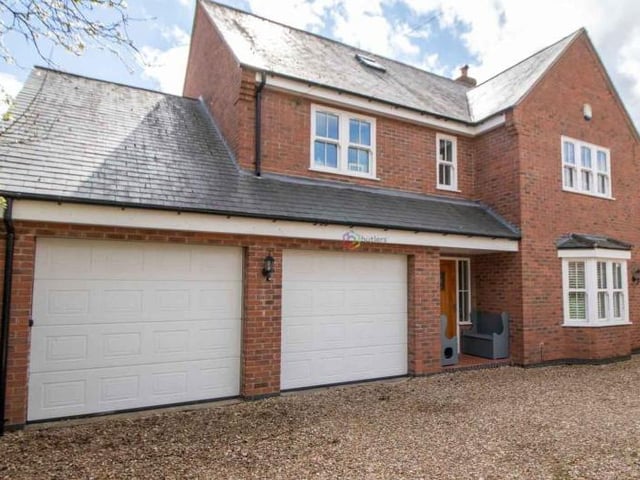 The last picture of our gallery shows the double garage. It has two single up-and-over electric doors, plus an internal door that leads to the property's utility room.