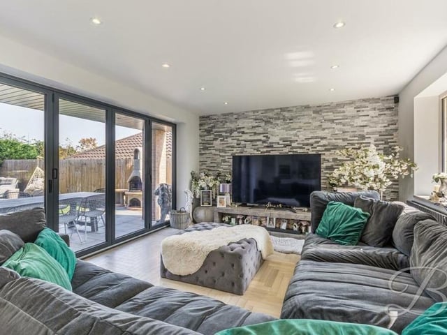 Connected seamlessly to the kitchen'diner is this splendid sitting room, with parquet-style flooring, double windows to the side and bi-folding doors leading outside.