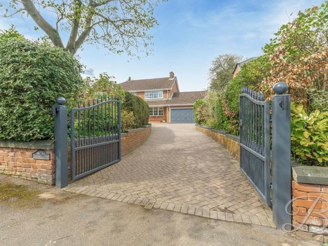 Through the entrance gates and on to the large, private block-paved driveway that provides lots of space for off-street parking.