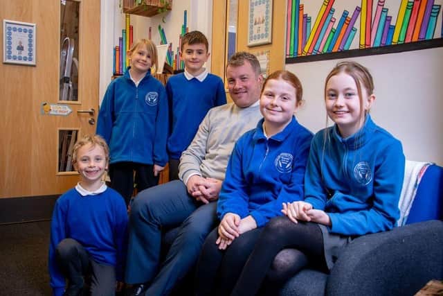 Headteacher Andrew Whittle is pictured with some of the Mapplewells pupils