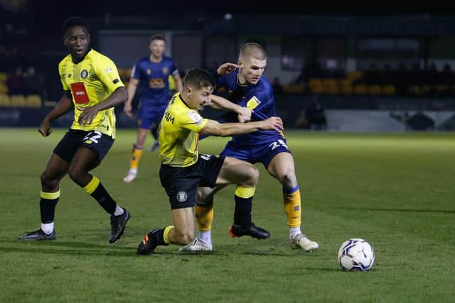 Mansfield Town midfielder Ryan Stirk in action at Harrogate. Photo by Chris Holloway/The Bigger Picture.media