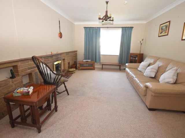 The lounge is a large, flexible room, spacious enough to accommodate a dining area. The room is decorated with coving to the ceiling, while there is a living-flame gas fire with stole surround.