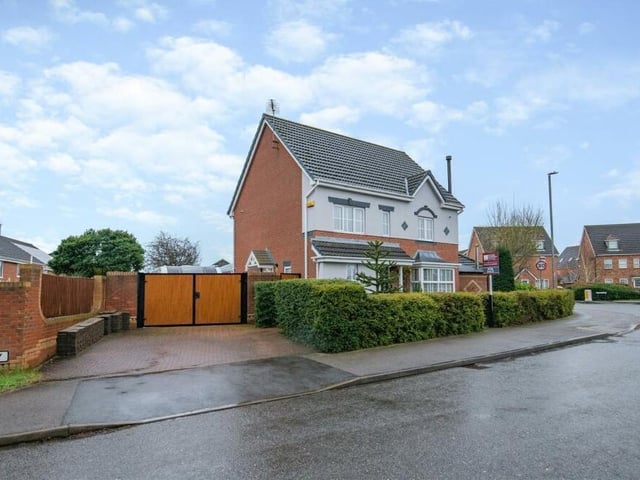 This wide-angle shot shows how the three-storey property occupies a large corner plot