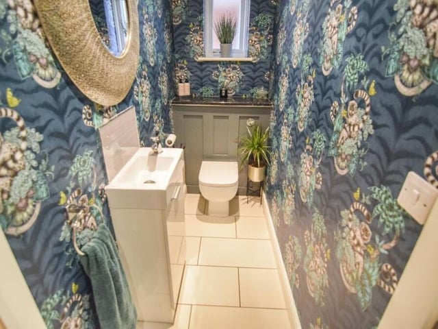 The ground floor of the £575,000 property includes this bonny and cheerful toilet, complete with WC and wash hand basin.