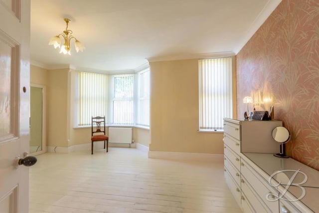 The main bedroom, which overlooks the front of the house, is extremely spacious. It's also very bright thanks to two double-glazed windows, one of which is a gorgeous bay. The wooden floor gives the room plenty of character.