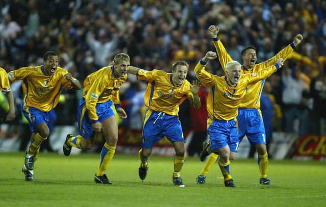 The Mansfield team celebrate after the penalty shoot out win.